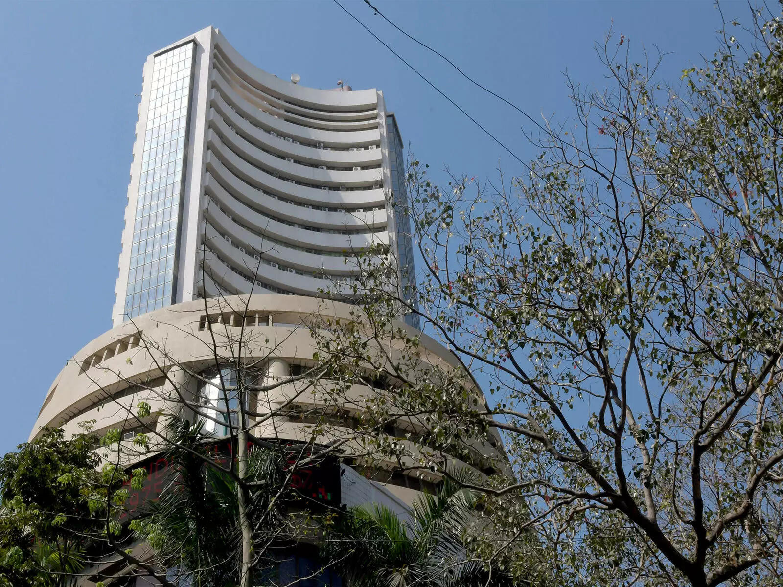 Market wrap: Sensex closes flat, Nifty holds 23,400; Titan, Eternal lead gains